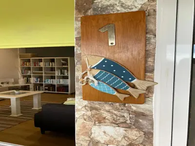 a door with a wall with a number on it at Studio in Porto da Cruz with Ocean Views in Porto da Cruz