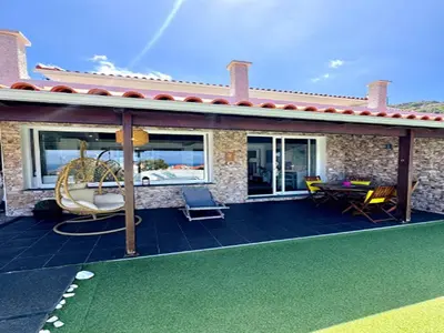 a house with a patio with a playground at Holiday home in Porto da Cruz with garden in Porto da Cruz