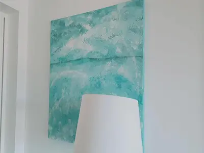 a painting hanging on a wall next to a table at Holiday home in Porto da Cruz with garden in Porto da Cruz