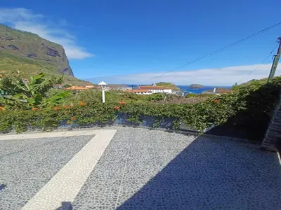 a walkway with a view of a mountain at Villa in Porto da Cruz with Ocean Views in Porto da Cruz