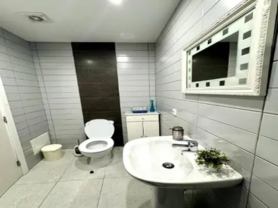 a white bathroom with a toilet and a sink at Villa in Porto da Cruz with Ocean Views in Porto da Cruz