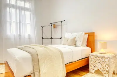 a bedroom with a bed and a window at Casa do Pinheiro I, a Home in Madeira in São Vicente