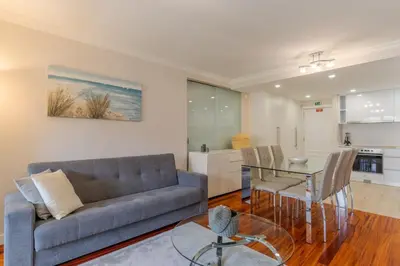 a living room with a couch and a glass table at Stay In Avenue Arriaga 10, by Pausa H. Rentals in Funchal