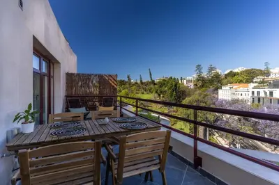 a balcony with a table and chairs and a view at Stay In St. Catarina Park, by PAUSA H. Rentals in Funchal