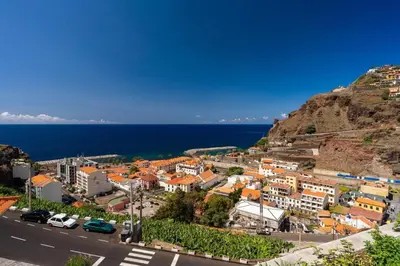 an aerial view of a town on the side of a hill at Renala I-Apart. 
