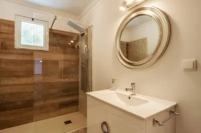 a bathroom with a sink and a shower at Renala I-Apart. 