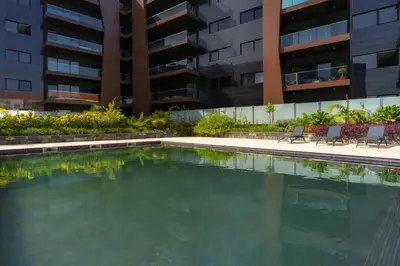 a swimming pool in front of a building at Renala II - Apart, With Pool, by Pausa H. Rentals in Funchal