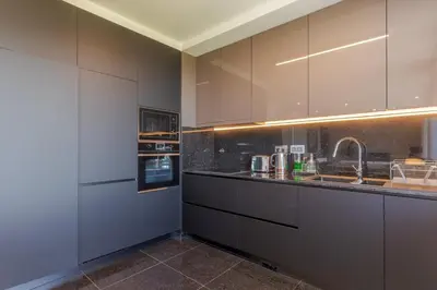 a kitchen with gray cabinets and a sink at Renala III, by Pausa Holiday Rentals in Funchal