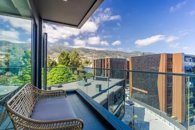 a balcony with a bench and a view at Renala III, by Pausa Holiday Rentals in Funchal