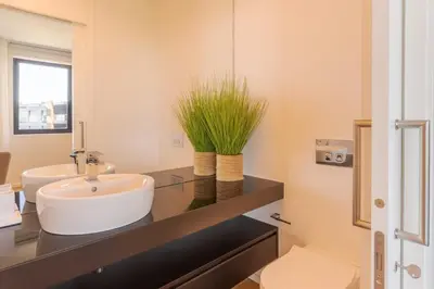 a bathroom with a sink and a mirror at Renala III, by Pausa Holiday Rentals in Funchal