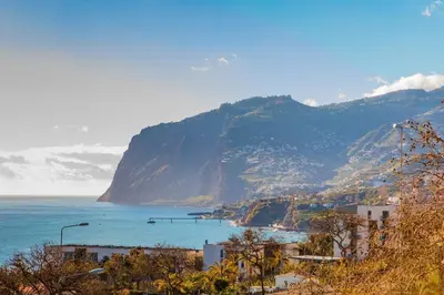 a view of the ocean and a mountain at Rodamar Penthouse in Funchal