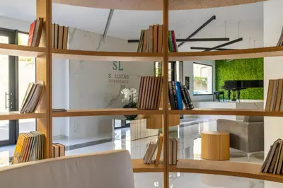 a room with a lot of shelves with books at Stay In S.Lucas Residence, by Pausa H. Rentals in Funchal