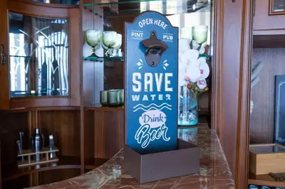 a sign that says save water drink fresh on a counter at Casa Almada in Ribeira Brava