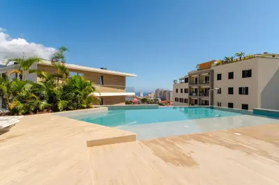 a swimming pool on the roof of a building at GuestReady - Elegant Madeira Retreat in Funchal