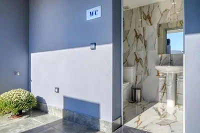 a blue and white bathroom with a sink at BSE15 Apartments 2D, a Home in Madeira in Funchal