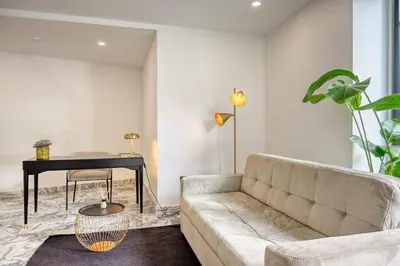 a living room with a couch and a table at BSE15 Apartments 2D, a Home in Madeira in Funchal