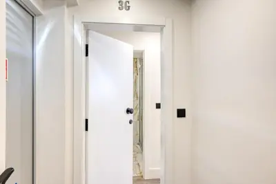 a hallway with white walls and a white door at BSE15 Apartments 3G, a Home in Madeira in Funchal