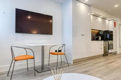 a dining room with a table and two chairs at BSE15 Apartments 2E, a Home in Madeira in Funchal