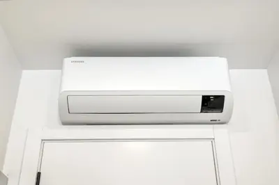 a white microwave sitting on top of a white cabinet at BSE15 Apartments 2E, a Home in Madeira in Funchal