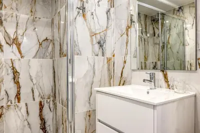 a bathroom with a sink and a shower at BSE15 Apartments 3H, a Home in Madeira in Funchal