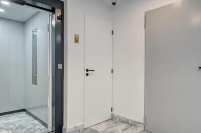 a bathroom with a glass door and a mirror at BSE15 Apartments 4K, a Home in Madeira in Funchal