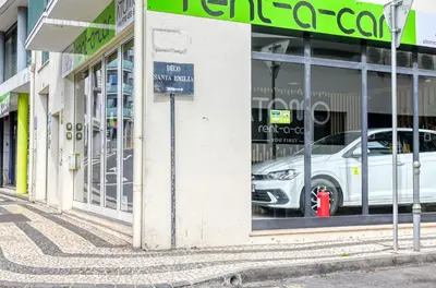a white car in a store window with a red fire hydrant at BSE15 Apartments 2F, a Home in Madeira in Funchal