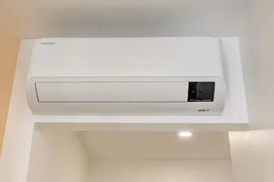 a white microwave oven hanging from a ceiling at BSE15 Apartments 4L, a Home in Madeira in Funchal