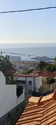 a view of the ocean from the roof of a building at Casa Isa - Funchal in Funchal