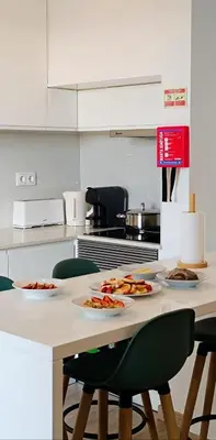 a kitchen with plates of food on a table at Casa Isa - Funchal in Funchal