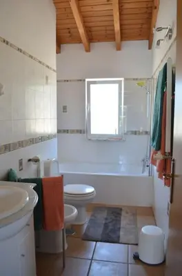 a bathroom with a toilet and a tub and a sink at Wanderlust - Beautiful Villa in Aljezur in Aljezur