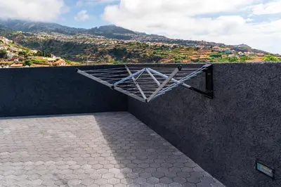 a metal rack on the side of a wall at Star House -Jacuzzi & Aircon in Calheta