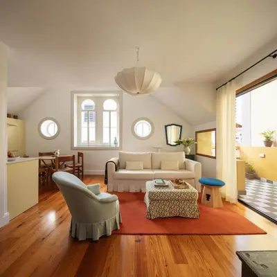a living room with a couch and a table at Carmo 33 in Funchal