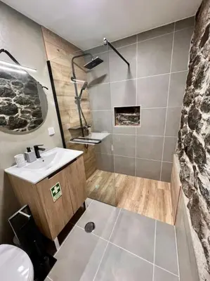a bathroom with a sink and a shower at Roots Guesthouse - A in São Vicente