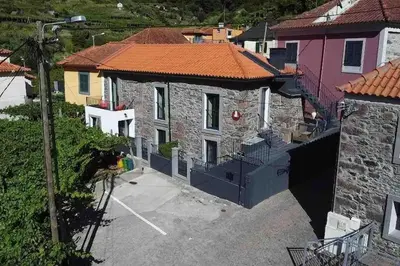 an aerial view of a house with a yard at Roots Guesthouse- B in São Vicente