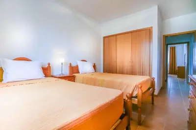 two beds in a hotel room with two beds at Hadassa Sunrise Refuge in Porto Santo