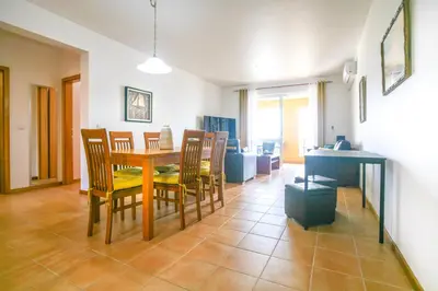 a dining room with a table and chairs at Hadassa Sunrise Refuge in Porto Santo