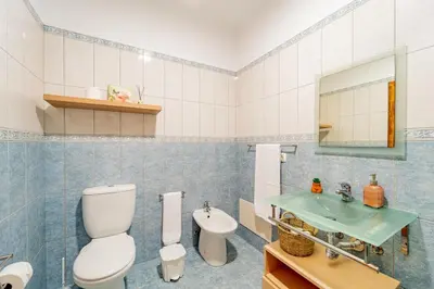 a bathroom with a toilet and a sink at Refúgio das Fontes in Senhora do Rosário