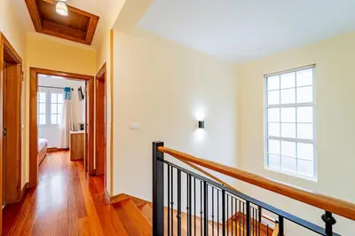 a staircase in a house with a window at Refúgio das Fontes in Senhora do Rosário