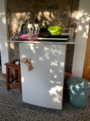 a white refrigerator with a shelf on top of it at Pico Paraiso Madeira in Ponta do Sol