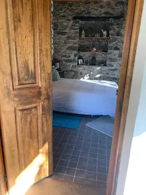 a door leading into a bedroom with a bed at Pico Paraiso Madeira in Ponta do Sol