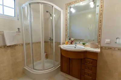 a bathroom with a shower and a sink at Varandas da Caldeira by Madeira ReAL in Câmara de Lobos