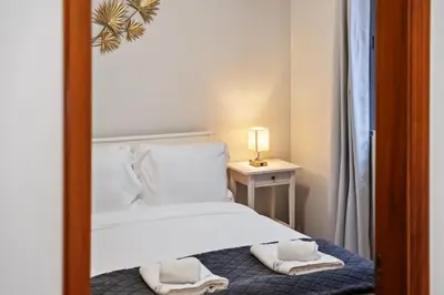 a bedroom with a bed with towels on it at Ocean Flyby in Gaula