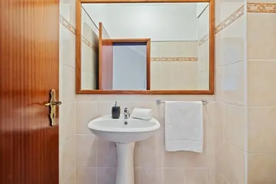 a bathroom with a sink and a mirror at Ocean Flyby in Gaula