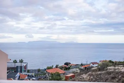 a view of the ocean from a city at Ocean Flyby in Gaula