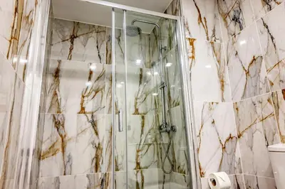 a bathroom with a shower with a glass door at BSE15 Apartments 3I, a Home in Madeira in Funchal