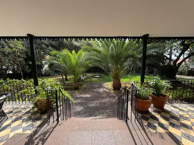 a wrought iron gate with plants in a garden at Quinta Dias in Funchal