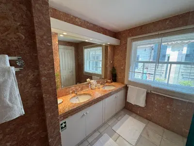 a bathroom with two sinks and a large mirror at Quinta Dias in Funchal