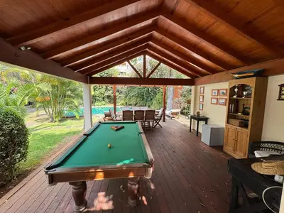 a screened porch with a pool table on a deck at Quinta Dias in Funchal
