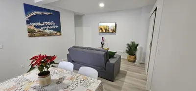 a living room with a couch and a table at TIME OFF Madeira in Funchal
