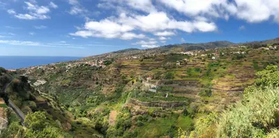 a view of a mountain with houses on it at Casa Kiri in Calheta